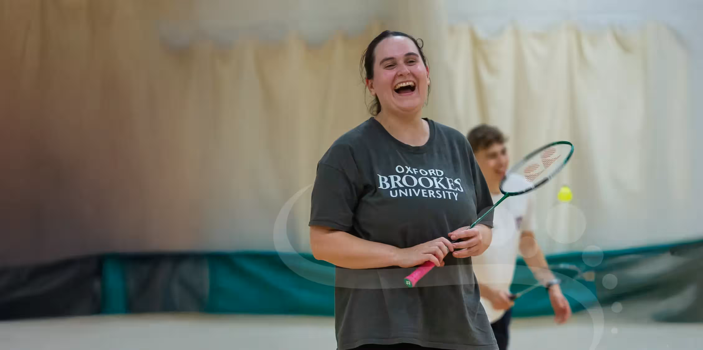 Badminton players mid-rally